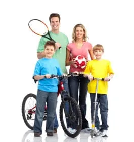 A family with bicycles and a football